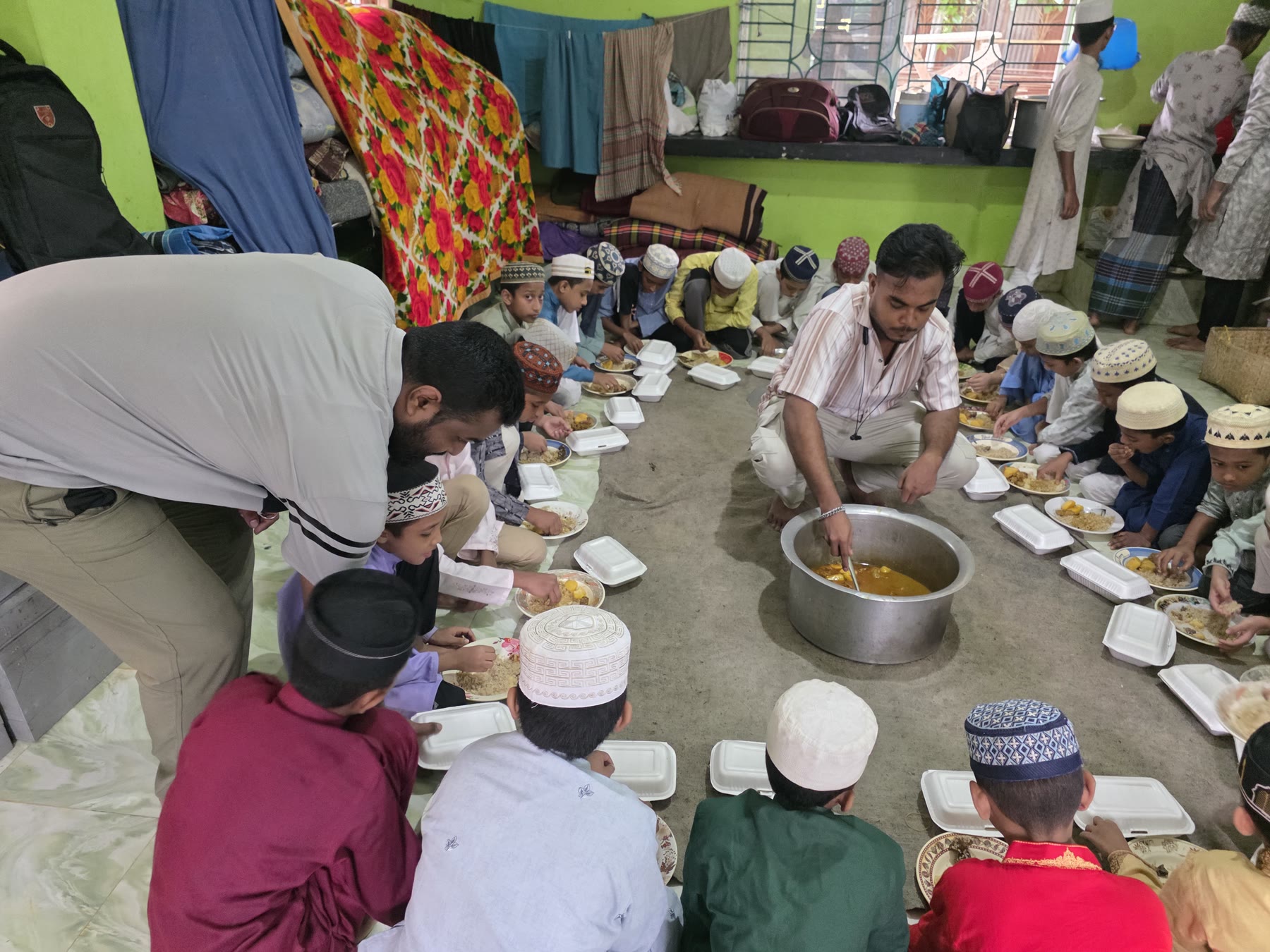Meal service for orphan children at a madrasa in Case 004